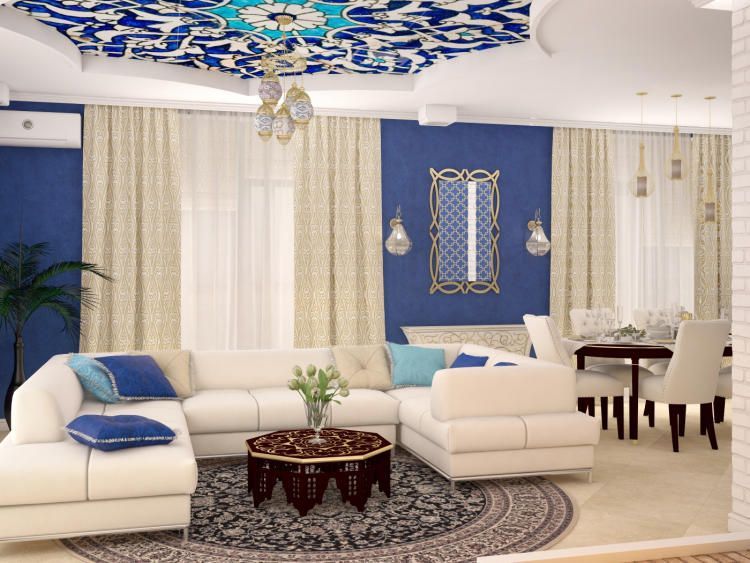 Гостиная в арабском стиле: роскошные ковры, мебель, небольшой журнальный столик и экзотическое оформление интерьера. 